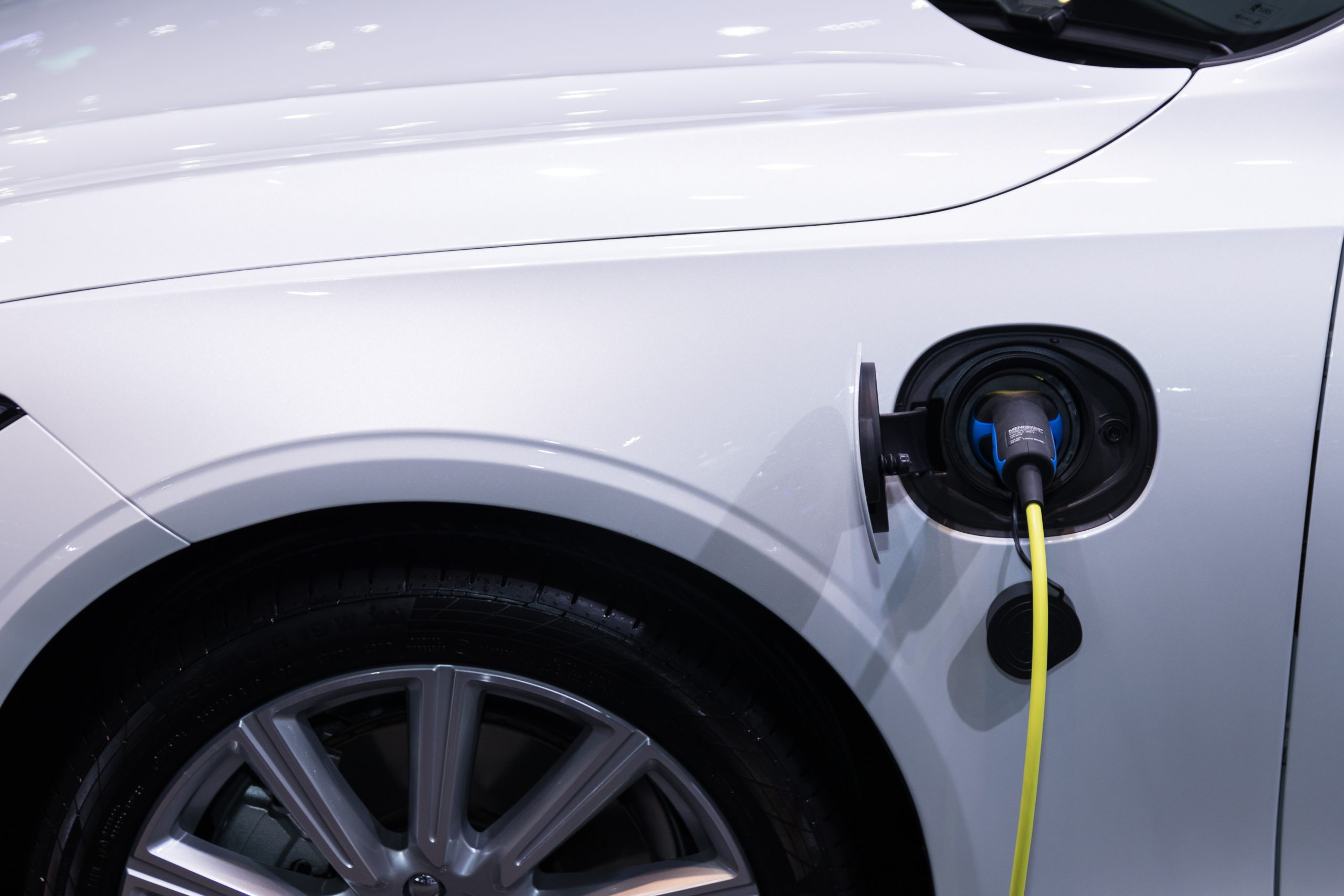 image of an EV charger plugged into a car