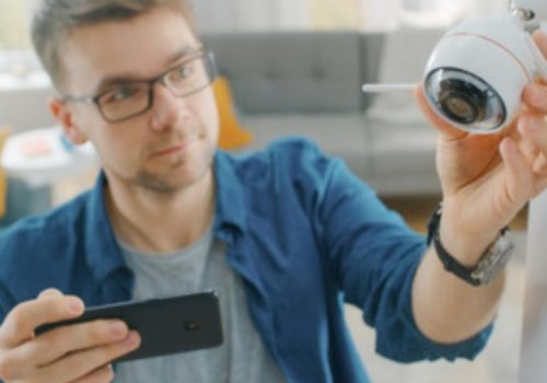 Man installing CCTV camera